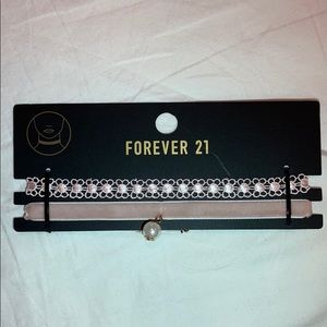 Two light pink chokers